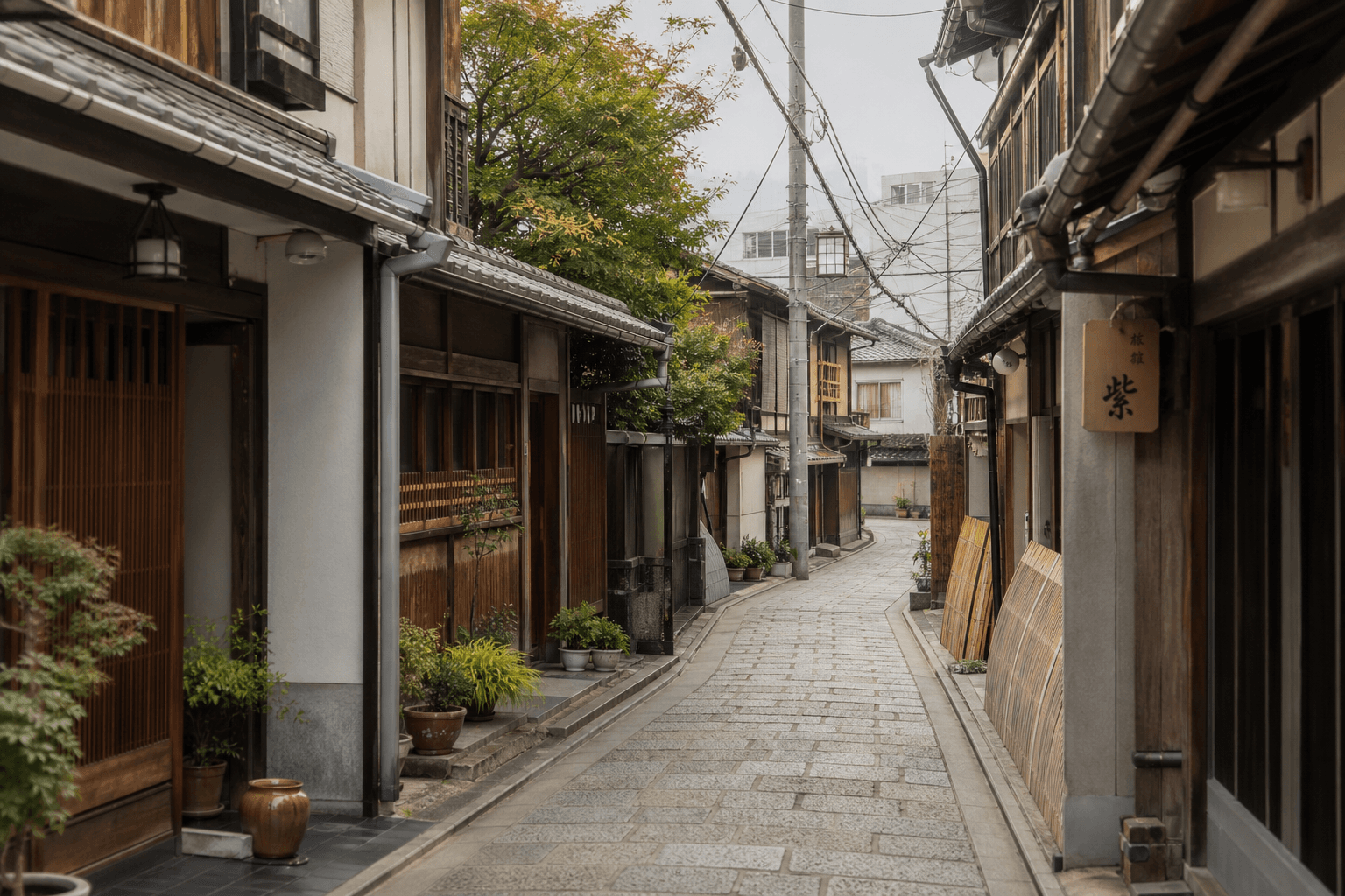 A quiet Kyoto residential lane with traditional machiya townhouse texture in morning light.